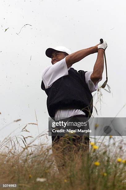 World No.1 Tiger Woods plays his second shot from the deep rough at the par 4 13th hole during the third round of the New Zealand Open at the...