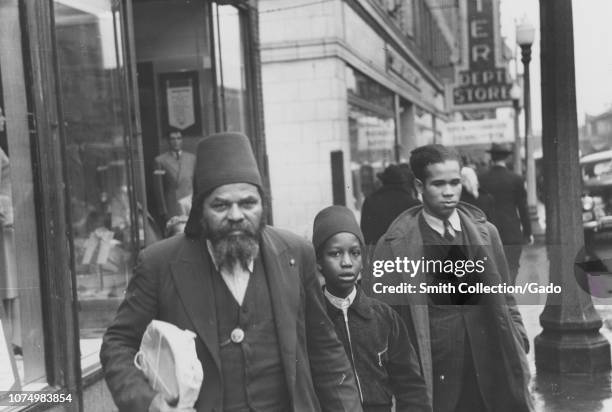 Photograph of three members of the Moors, an African-American religious group of Chicago, Illinois, 1935. From the New York Public Library.