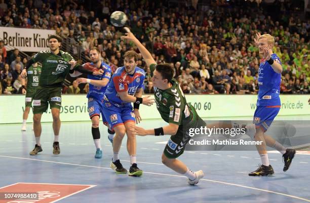 December 26: Frederik Simak of the Fuechse Berlin, Nico Buedel, Michael Haass of HC Erlangen, Frederik Simak of the Fuechse Berlin and Andreas...