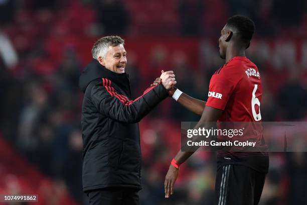 Ole Gunnar Solskjaer, Interim Manager of Manchester United and Paul Pogba of Manchester United celebrate following their sides victory in the Premier...