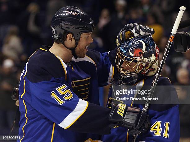 Jay McClement of the St. Louis Blues congratulates Jaroslav Halak following a game against the Columbus Blue Jackets at the Scottrade Center on...