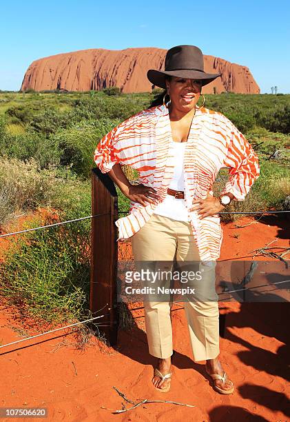 Oprah Winfrey poses in front of Ayres Rock during a tour to Uluru on December 9, 2010 in Uluru, Australia. . Oprah Winfrey is in Australia with 302...