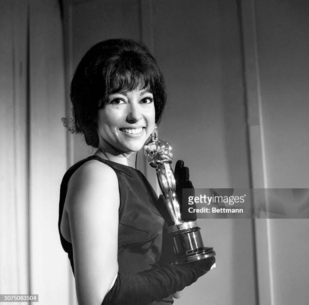 Rita Moreno poses with her Oscar after she was named "Best Supporting Actress" for her role in "West Side Story."