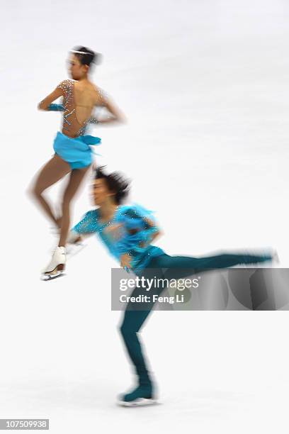 Pang Qing and Tong Jian of China skate in the Pairs Short Program during ISU Grand Prix and Junior Grand Prix Final at Beijing Capital Gymnasium on...