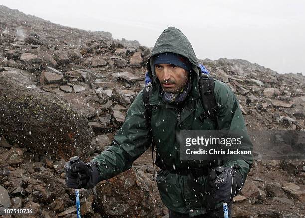 Laureus trekkers climb to high camp in a snow storm at around 4700m on day five of the Martina Navratilova Mt. Kilimanjaro Climb Day One on December...
