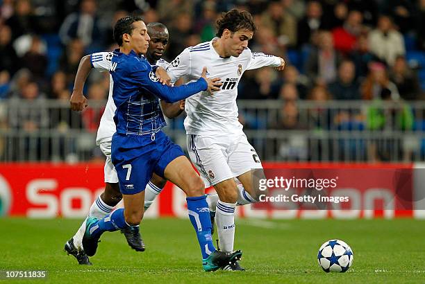 Pedro Leon of Real Madrid is challenged by Kamel Chafni of Auxerre during the Champions League group G match between Real Madrid and AJ Auxerre at...