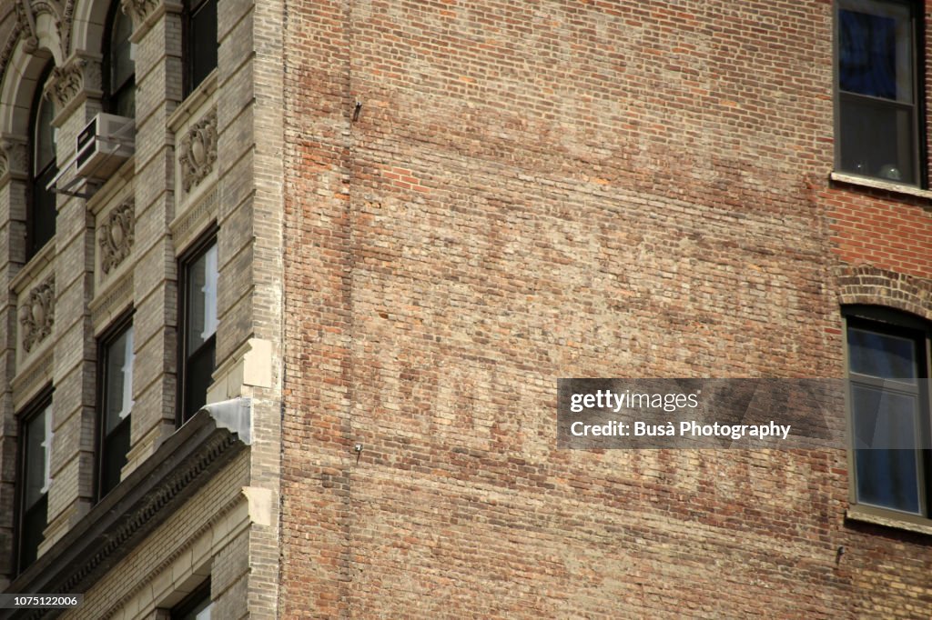 Traces of old commercial mural in Manhattan, New York City