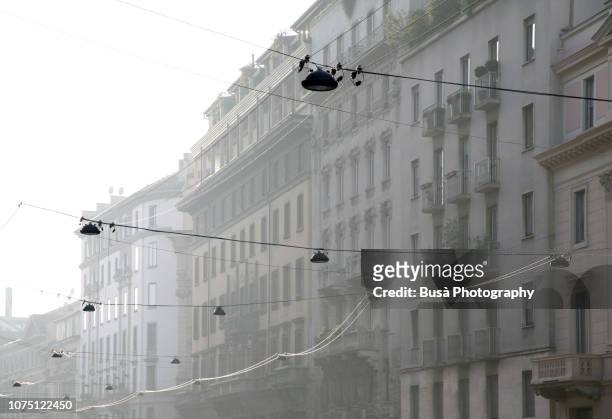 air pollution in the streets of milan, italy - pollution in milan stock pictures, royalty-free photos & images