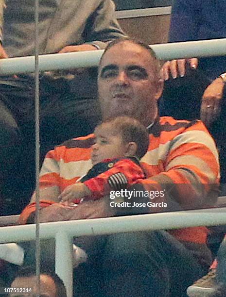 Jose Andrade holds Cristiano Ronaldo's son, Cristiano Ronaldo jr during the Champions League group G match between Real Madrid and AJ Auxerre at...