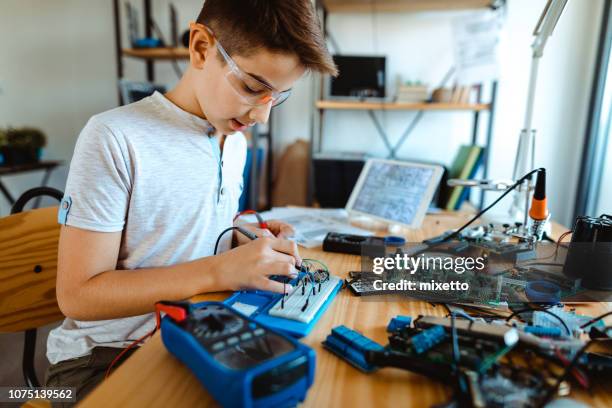 Child Using Multimeter 434 Solder And Child Stock Photos, High-Res Pictures, and Images ...