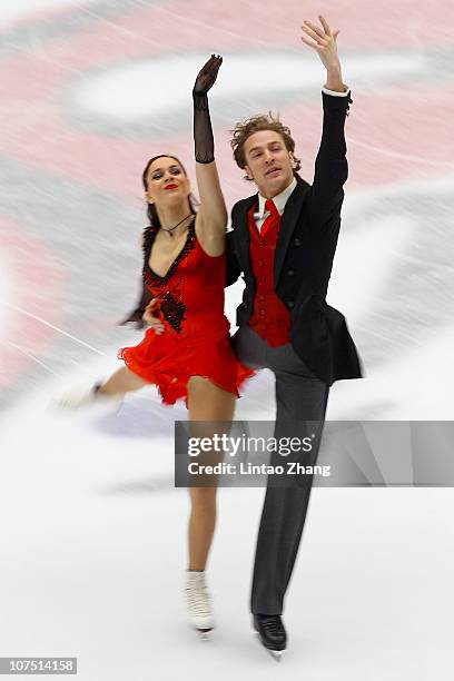 Nathalie Pechalat and Fabian Bourzat of France skate in the Ice Dance Short Dance during ISU Grand Prix and Junior Grand Prix Final at Beijing...