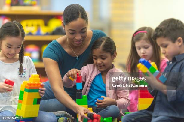 teacher and students playing - ymca stock pictures, royalty-free photos & images