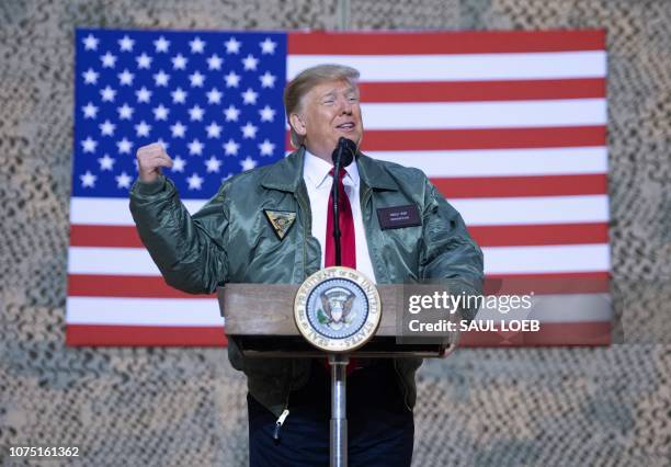 President Donald Trump speaks to members of the US military during an unannounced trip to Al Asad Air Base in Iraq, December 26, 2018. President...