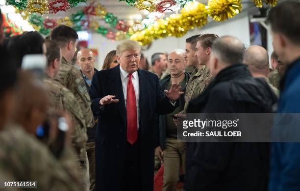 President Donald Trump greets members of the US military during an unannounced trip to Al Asad Air Base in Iraq on December 26, 2018. - President...