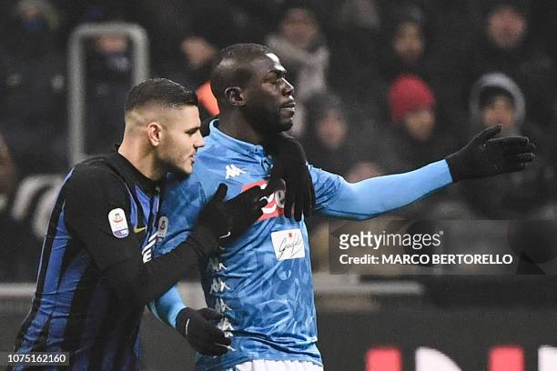 Inter Milan's Argentine forward Mauro Icardi comforts Napoli's Senegalese defender Kalidou Koulibaly after he received a red card during the Italian...