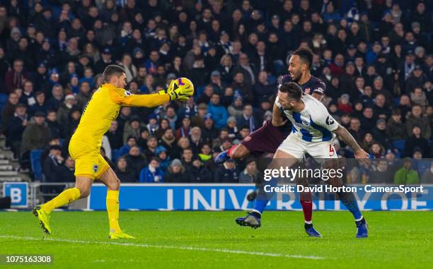 Brighton & Hove Albion's Matthew Ryan and Shane Duffy under pressure from Arsenal's Pierre-Emerick Aubameyang during the Premier League match between...