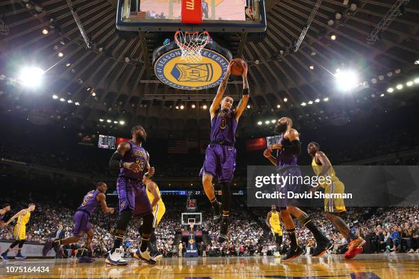 Kyle Kuzma of the Los Angeles Lakers gets the rebound against the Golden State Warriors on December 25, 2018 at ORACLE Arena in Oakland, California....