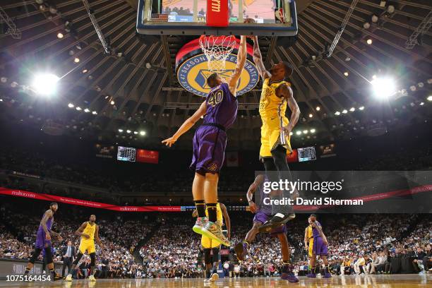 Ivica Zubac of the Los Angeles Lakers blocks the ball Alfonzo McKinnie of the Golden State Warriors on December 25, 2018 at ORACLE Arena in Oakland,...