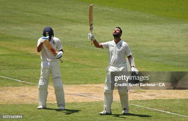 Cheteshwar Pujara is congratulated by Virat Kohli as he celebrates his century during day two of the Third Test match in the series between Australia...