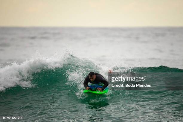 Andre Melo de Souza or Andrezinho Carioca, adapted surfer's nickname, practices at Prainha beach on December 26, 2018 in Rio de Janeiro, Brazil....