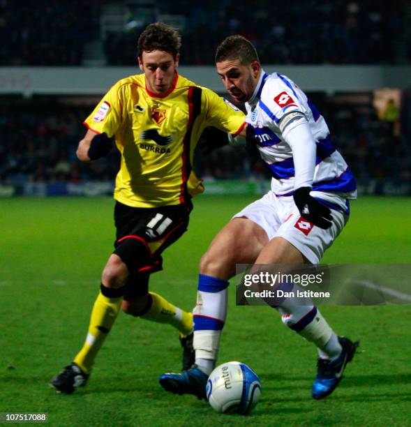 Adel Taarabt of QPR battles for the ball with Will Buckley of Watford during the npower Championship match between Queens Park Rangers and Watford at...