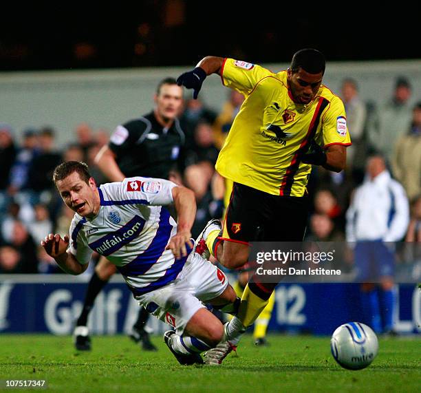 Heidar Helguson of QPR is challenged by Adrian Mariappa of Watford during the npower Championship match between Queens Park Rangers and Watford at...