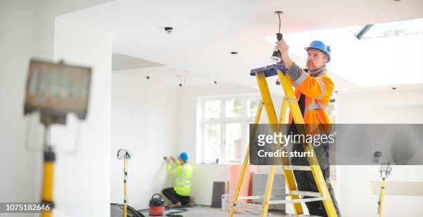 electric house rewire - electrician working stock pictures, royalty-free photos & images