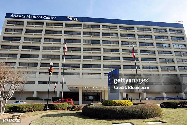 Cars stand parked outside of Tenet Healthcare's Atlanta Medical Center in Atlanta, Georgia, U.S., on Friday, Dec. 10, 2010. Community Health Systems...