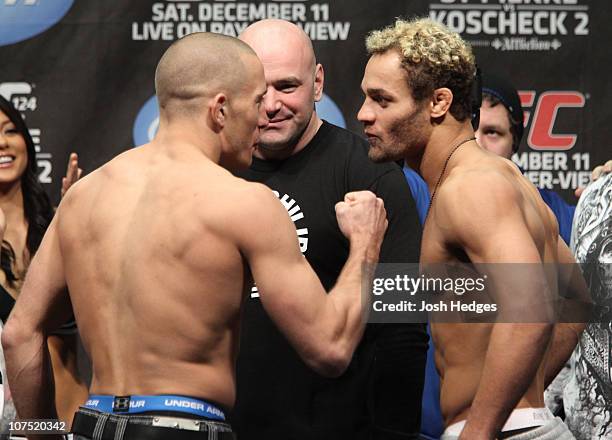 Opponents Georges St-Pierre and Josh Koscheck face off as UFC President Dana White looks on at the UFC 124 Weigh-in at the Bell Centre on December...