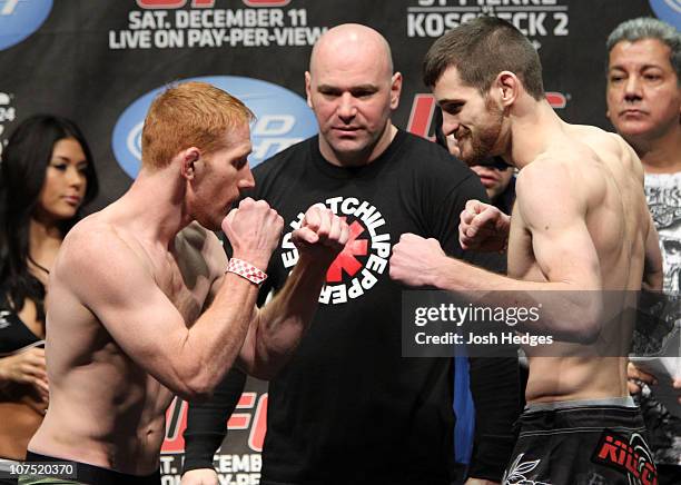 Lightweight opponents Mark Bocek and Dustin Hazelett face off as UFC President Dana White looks at the UFC 124 Weigh-in at the Bell Centre on...