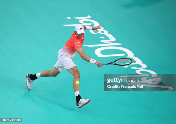 Kevin Anderson of South Africa plays a backhand against Hyeon Chung of South Korea during his men's singles match on day one of the Mubadala World...