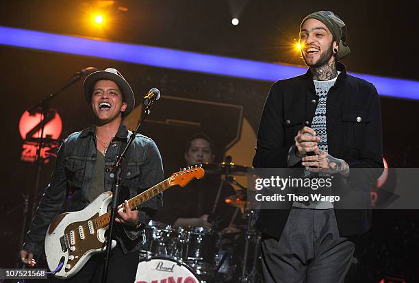 Bruno Mars and Travie McCoy perform onstage during Z100's Jingle Ball 2010 presented by H&M at Madison Square Garden on December 10, 2010 in New York...