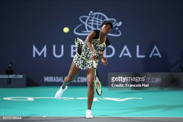 Venus Williams of United States in action against Serena Williams of United States during her Women's singles match on day one of the Mubadala World...
