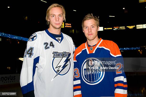 Former teammates in Sweden, Johan Harju of the Tampa Bay Lightning and Linus Omark of the Edmonton Oilers, pose for a photo before their first NHL...