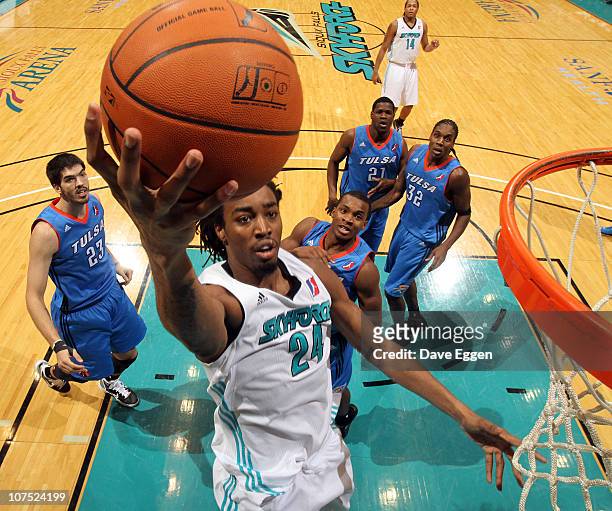 Raymond Sykes of the Sioux Falls Skyforce lays the ball up past four players of the Tulsa 66ers in the second half of their game December 10, 2010 at...
