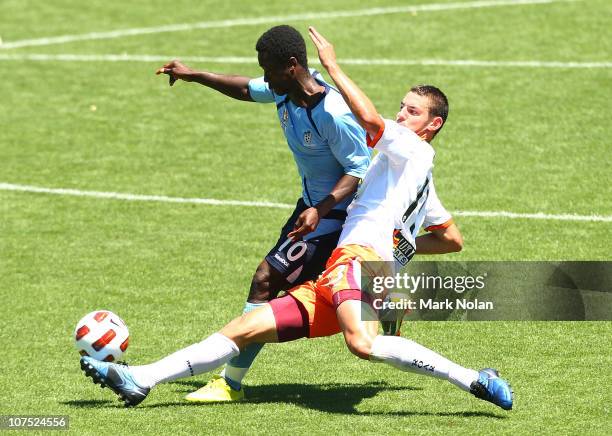 Kofi Danning of Sydney is tackled by Dane Milovanovic of the Roar during the round 13 Youth League match between Sydney FC and the Brisbane Roar at...