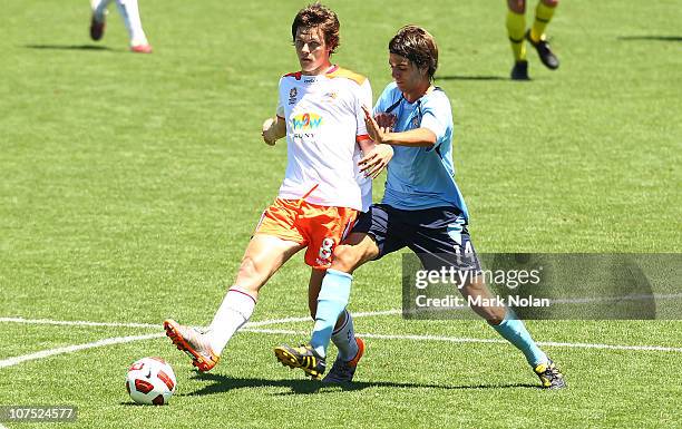 James Donachie of the Roar and Peter Simonski of Sydney contest possession during the round 13 Youth League match between Sydney FC and the Brisbane...