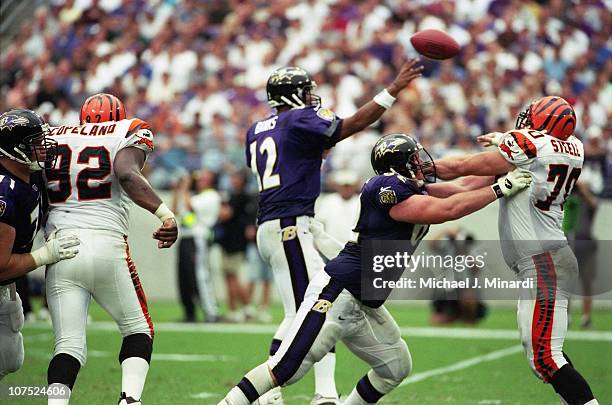 Offensive Lineman Mike Flynn of the Baltimore Ravens blocks Defensive Tackle Glen Steele of the Cincinnati Bengals and keeps him away from...