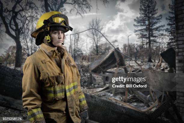 california firefighter by coffey park neighborhood after wildfire destroyed homes in the neighborhood - forest fire house stock pictures, royalty-free photos & images