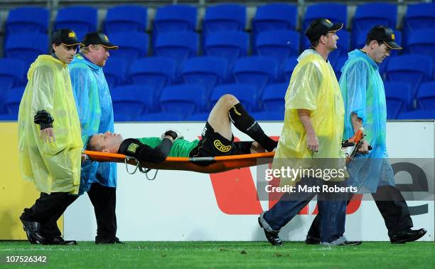 Mark Paston of the Phoenix is stretched off during the round 18 A-League match between Gold Coast United and the Wellington Phoenix at Skilled Park...