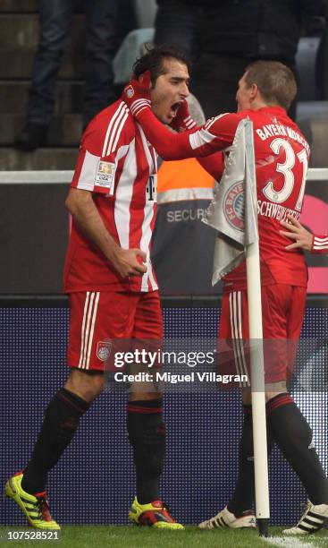 Hamit Altintop of FC Bayern Muenchen celebrates his side's first goal with his team mate Bastian Schweinsteiger during the Bundesliga match between...