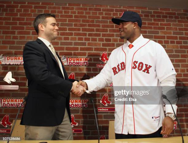 Theo Epstein , general manager of the Boston Red Sox, welcomes Carl Crawford to the team during a press conference to announce Crawford's signing on...