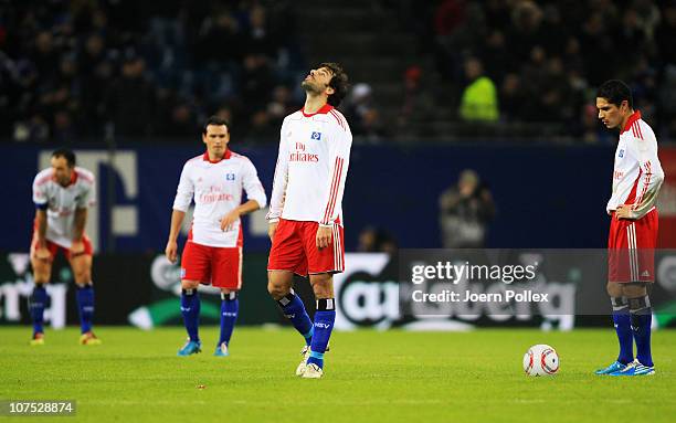 Player of Hamburg are seen after Leverkusens fourth goal during the Bundesliga match between Hamburger SV and Bayer Leverkusen at Imtech Arena on...