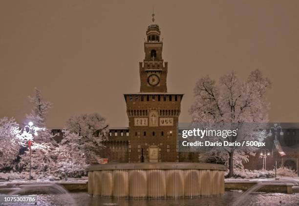 castello sforzesco innevato - innevato stock pictures, royalty-free photos & images