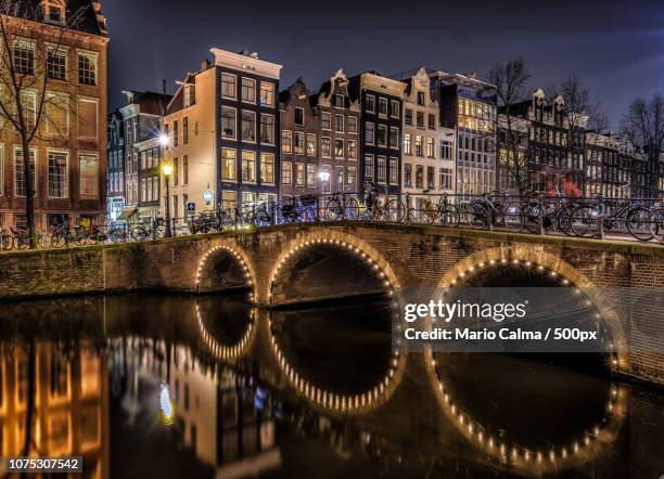 canals of amsterdam - mario calma stockfoto's en -beelden