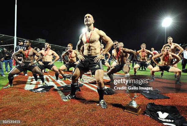 Forbes and New Zealand team-mates do the Haka beside the trophy after winning the Cup final against England on day 2 of the HSBC Sevens World Series...