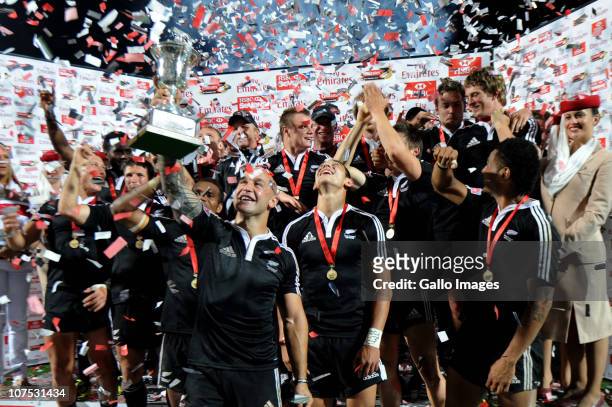 Forbes and New Zealand team-mates celebrate with the trophy after the Cup final against England on day 2 of the HSBC Sevens World Series Emirates...