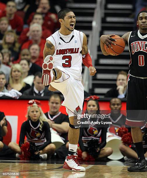 Peyton Siva of the Louisville Cardinals celebrates during the game against the UNLV Runnin' Rebels at KFC YUM! Center on December 11, 2010 in...