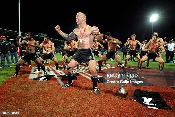 Forbes and New Zealand team-mates do the Haka beside the trophy after winning the Cup final against England on day 2 of the HSBC Sevens World Series...