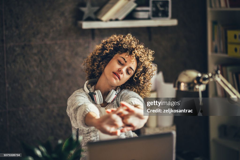 Woman stretching in the office